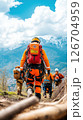 First responders guide rescue efforts in mountainous terrain after natural disaster 126704959