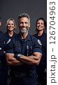 Paramedics and firefighters unite for a team portrait showcasing diversity and resilience 126704963