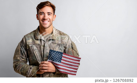 Silhouette of a soldier with a US flag against a sunset. Greeting card for Veterans Day, Memorial Day. Election Day in the USA. America Day. Festive Mood on President's Day 126708892