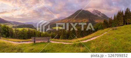 Meadow with road and bench during sunset in Berchtesgaden National Park Meadow with road and bench during sunset in Berchtesgaden National Park 126709852