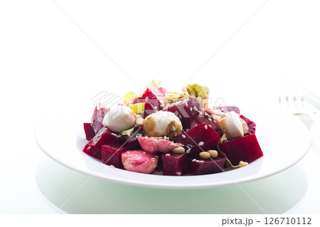 Delicious diet salad with mozzarella cheese and beetroot isolated on white background Delicious diet salad with mozzarella cheese and beetroot isolated on white background 126710112