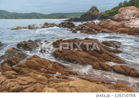 Landscape with rocks and stones by the sea. Panorama of Da Da reef or Ganh Da Dia in Phu Yen province in Vietnam Landscape with rocks and stones by the sea. Panorama of Da Da reef or Ganh Da Dia in Phu Yen province in Vietnam 126710768