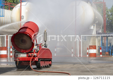 Fireman  attacking a fire with water. firefighter team work. 126711115