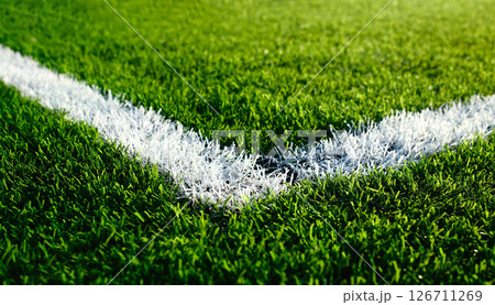 artificial green turf with white painted sports field boundary lines 126711269