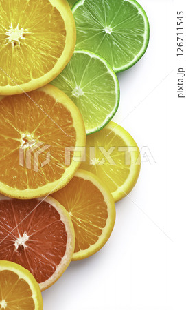 Vibrant citrus slices aligned in color transition. Clean gradient from orange to lime. Minimal, fresh, and summer-ready 126711545