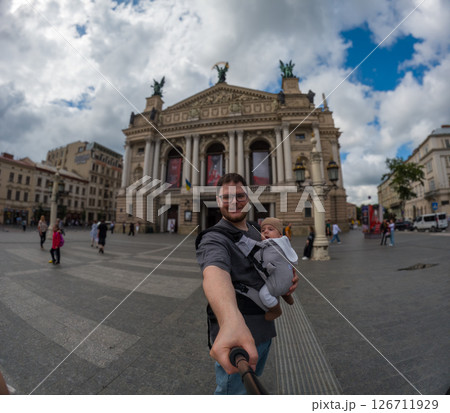 Father and Baby Taking a Selfie at a Grand Theater 126711929