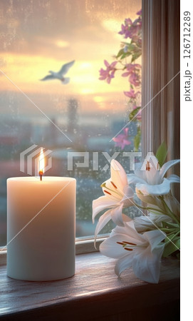 Peaceful candle memorial scene with white lilies and soft sunset light for funeral template use 126712289