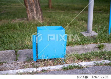 Trash can in the park blue 126712786