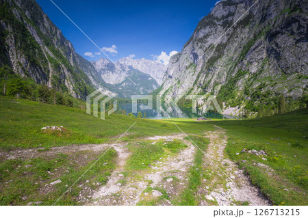 Mountain valley with tracks near Obersee lake in Berchtesgaden National Park Mountain valley with tracks near Obersee lake in Berchtesgaden National Park 126713215
