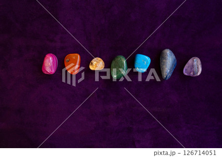 Healing crystals on violet background Healing crystals on violet background 126714051