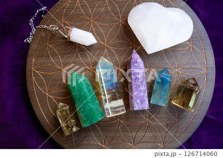 Healing crystals on brown background Healing crystals on brown background 126714060
