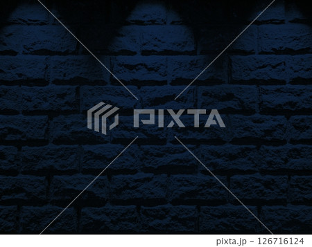 Old Stone Brick Wall with Three Blue Spotlight Beams from the Top. Old Stone Brick Wall with Three Blue Spotlight Beams from the Top. 126716124
