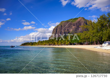 Tropical beach with boats, palm trees, and Le Morne Brabant mountain, Mauritius 126717730