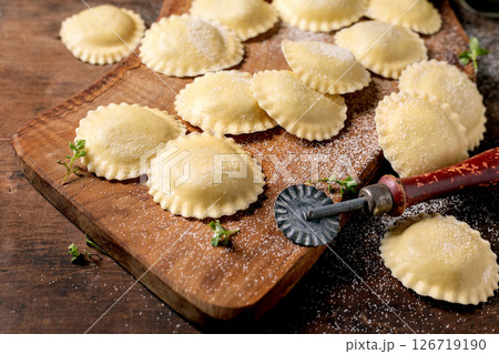 Fresh Homemade Ravioli on Wooden Board Fresh Homemade Ravioli on Wooden Board 126719190