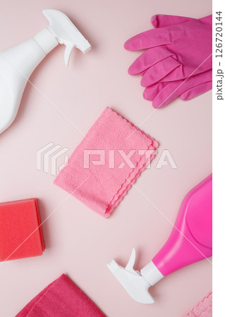 Household cleaning and hygiene concept. Pink cleaning supplies including rubber gloves, spray bottle, sponge, microfiber cloths 126720144