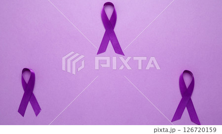 Purple ribbon held, symbol of support. Purple Epilepsy Awareness Day Purple ribbon held, symbol of support. Purple Epilepsy Awareness Day 126720159