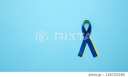 Symbolizing World Down Syndrome Day. A yellow and blue awareness ribbon 126720160
