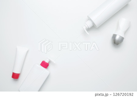 Cosmetic beauty products. Bottles and tubes with branding mock up. Skin care and beauty concept Cosmetic beauty products. Bottles and tubes with branding mock up. Skin care and beauty concept 126720192