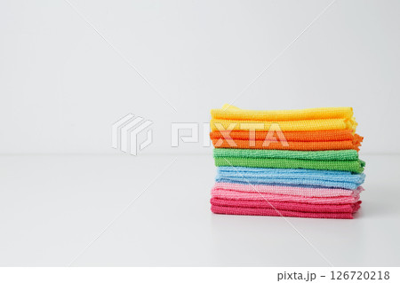 Colorful cleaning cloths neatly arranged, bringing brightness and energy to spring chores. Household cleaning and hygiene concept concept 126720218