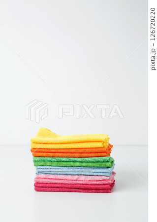 Colorful cleaning cloths neatly arranged, bringing brightness and energy to spring chores. Household cleaning and hygiene concept concept 126720220