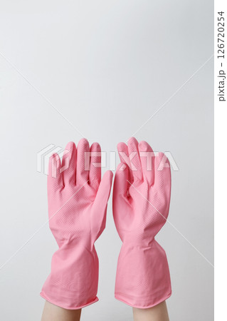 Female hands in pink rubber gloves doing house cleaning tasks. Household cleaning and hygiene concept conceptindoors 126720254