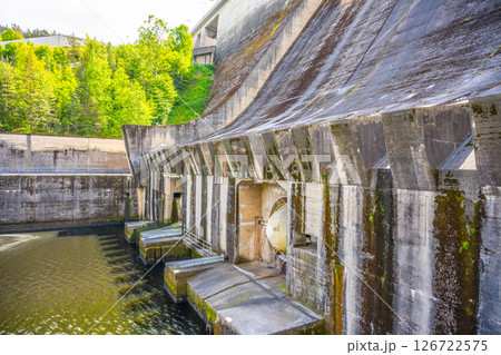 Constructed on the Vltava River, the Orlik Dam generates renewable energy while providing stunning views of nature. Surrounding greenery enhances the area's beauty during the day. Constructed on the Vltava River, the Orlik Dam generates renewable energy while providing stunning views of nature. Surrounding greenery enhances the area's beauty during the day. 126722575