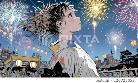 打ち上げ花火を見ている浴衣を着た若い女性