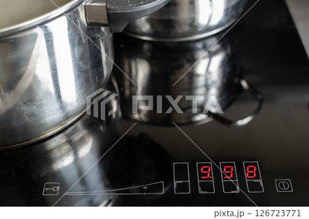 Discover the Modern Induction Cooktop that comes with Pots and features a Digital Display 126723771