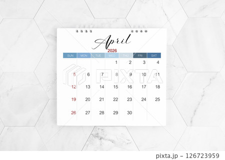 April 2026 blank desk calendar on marble table, Flat lay. April 2026 blank desk calendar on marble table, Flat lay. 126723959