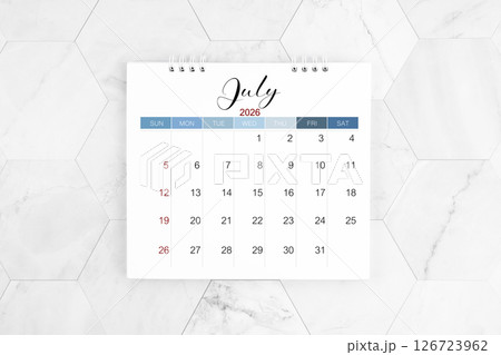 July 2026 blank desk calendar on marble table, Flat lay. 126723962