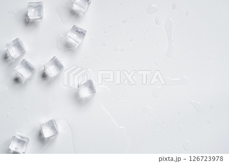 Melting ice cubes on a white background Melting ice cubes on a white background 126723978