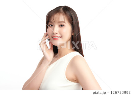 A beautiful young Asian woman with clean, fresh skin against a white background. Skincare, facial treatment, cosmetology, beauty, and spa. An elegant portrait of an Asian woman. A beautiful young Asian woman with clean, fresh skin against a white background. Skincare, facial treatment, cosmetology, beauty, and spa. An elegant portrait of an Asian woman. 126723992