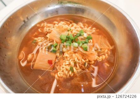 close up of a red Korean kimchi soup instant noodles in a bowl close up of a red Korean kimchi soup instant noodles in a bowl 126724226