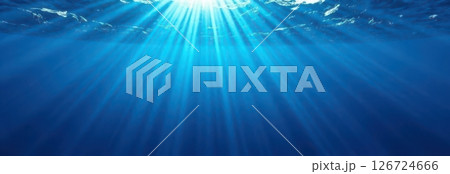Sunlight filtering through ocean surface creating beautiful beams of light 126724666