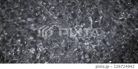 Black water with ripples. Defocus blurred black clear calm water surface texture with splashes and bubbles. Black water with ripples. Defocus blurred black clear calm water surface texture with splashes and bubbles. 126724942