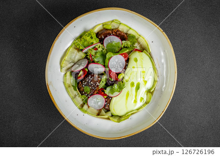 Fresh vegetable salad of green lettuce, radish and cucumber with dill, green onions and greek yogurt 126726196