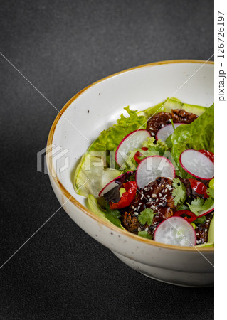 Fresh vegetable salad of green lettuce, radish and cucumber with dill, green onions and greek yogurt Fresh vegetable salad of green lettuce, radish and cucumber with dill, green onions and greek yogurt 126726197