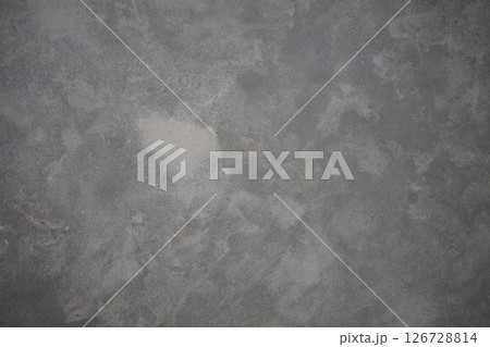 Texture of a gray concrete wall with white and gray veins. Grunge surface. Texture of a gray concrete wall with white and gray veins. Grunge surface. 126728814