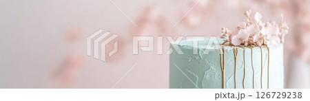 This enchanting sage green cake features delicate pressed edible flowers and shimmering gold leaf veins, beautifully showcasing an eco-friendly and natural aesthetic. Perfect for celebrations This enchanting sage green cake features delicate pressed edible flowers and shimmering gold leaf veins, beautifully showcasing an eco-friendly and natural aesthetic. Perfect for celebrations 126729238