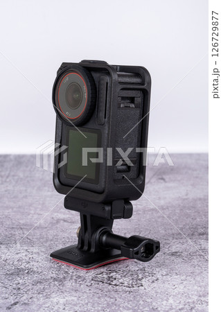 black action camera front view placed on the table 126729877