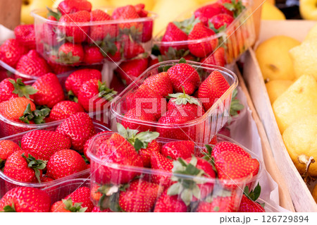 Fresh Strawberries in Plastic Containers at Market Fresh Strawberries in Plastic Containers at Market 126729894