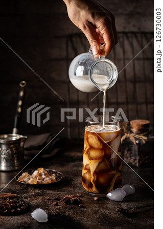 Ice coffee in a tall glass Ice coffee in a tall glass 126730003
