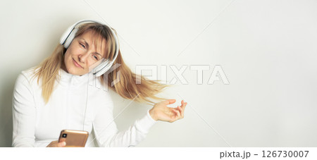 Woman enjoying music with headphones 126730007