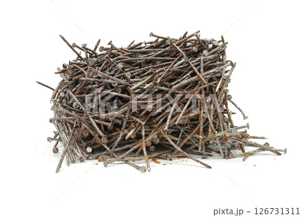 Rusty twisted nails extracted from wood. 126731311