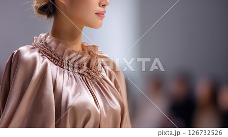 girl model on the catwalk at a fashion show in a stylish dress of the trendy color 2025 mocha mousse 126732526
