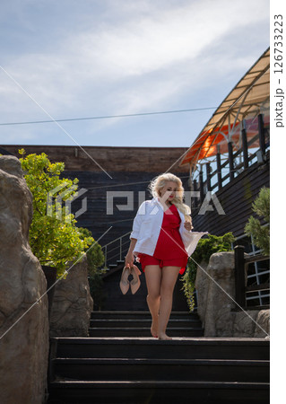 Woman Stairs Summer: Woman walks barefoot down stairs in summer outdoors to/from somewhere. Woman Stairs Summer: Woman walks barefoot down stairs in summer outdoors to/from somewhere. 126733223