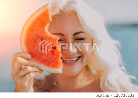 Watermelon Woman Summer Beach: Happy woman enjoys juicy watermelon slice near ocean, sunny day. 126733232