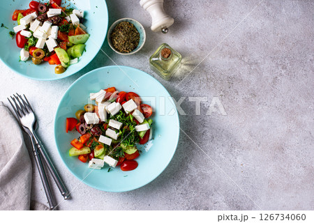 Greek salad with vegetables, olives and feta cheese Greek salad with vegetables, olives and feta cheese 126734060