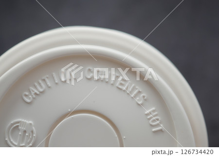 Cup base with caution warning about hot contents Cup base with caution warning about hot contents 126734420