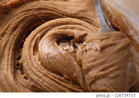 Thick Gingerbread Dough Being Lifted Close-Up Texture 126734713